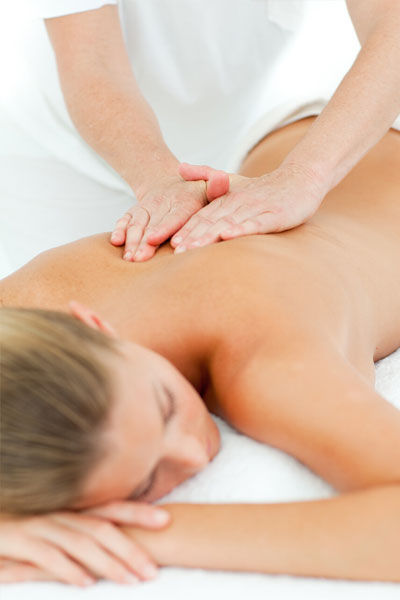 Hands massaging a woman's back