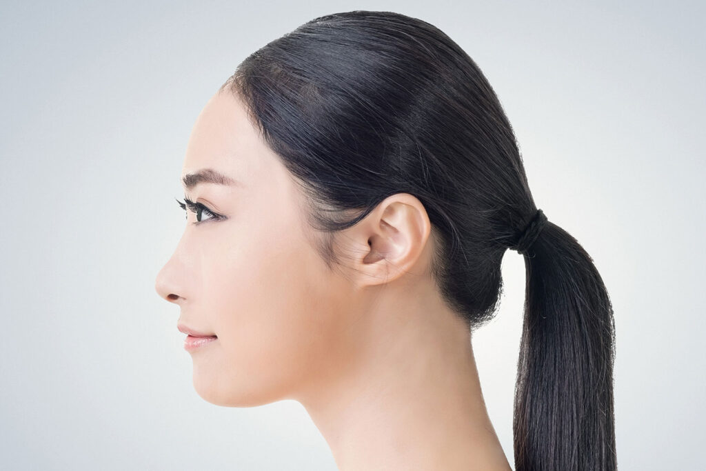 Side profile of woman to promote Coolsculpting of face and neck