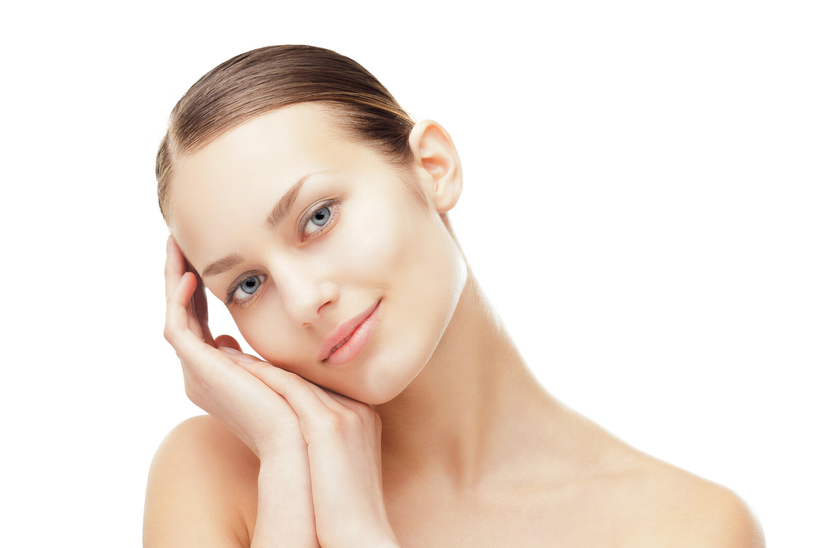 Woman looking at camera leaning on hands at the side of her face