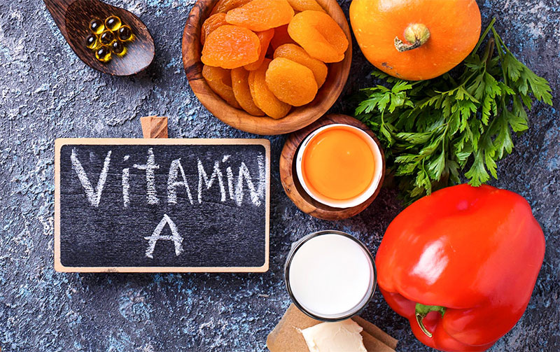 Vegetables and chalkboard with Vitamin A