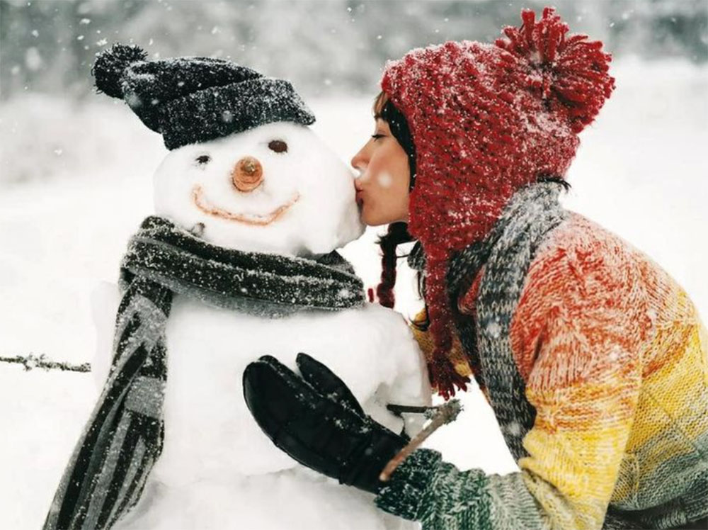 Woman Kissing a Snowman